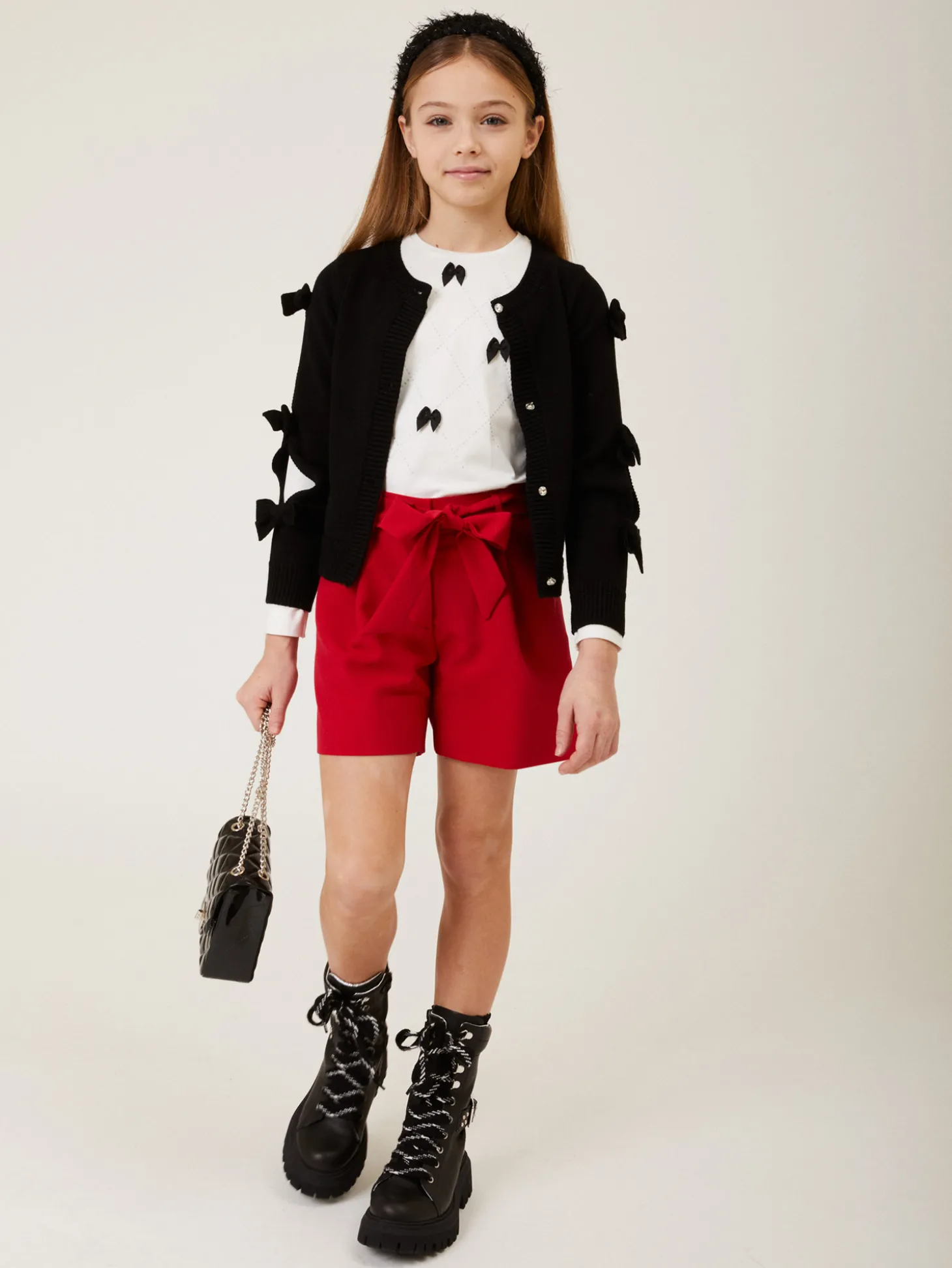 Cardigan con fiocchi applicati